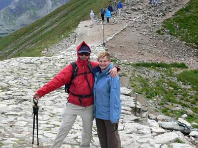 Walkers standing on the border of Poland and Slovakia in the High Tatras