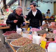 Smelling the spices at the Mahane Yehuda Market in Jerusalem Israel