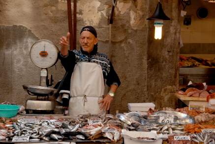 Fish Monger at the Siracusa market Sicily