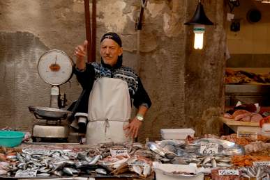 Fish Monger at the Siracusa market Sicly