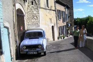 The old ramparts in Forcalquier with an old Renault 4