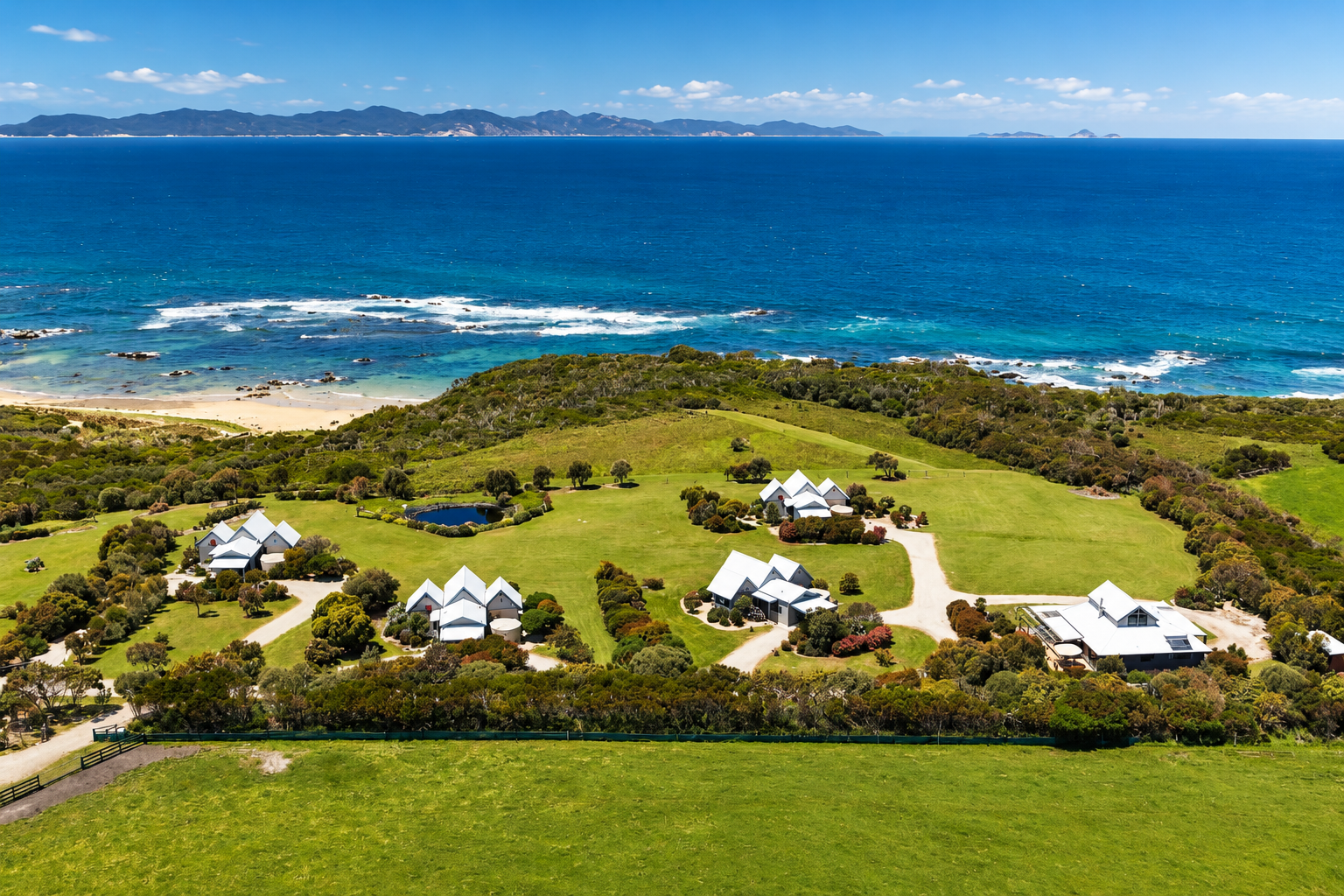 Aerial Coastal Estate and Turquoise Ocean